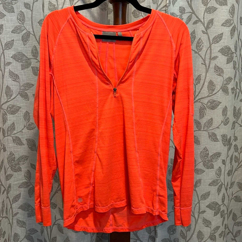 Vintage Athleta long sleeve neon orange athletics top. Zipper 3/4. Hi/low